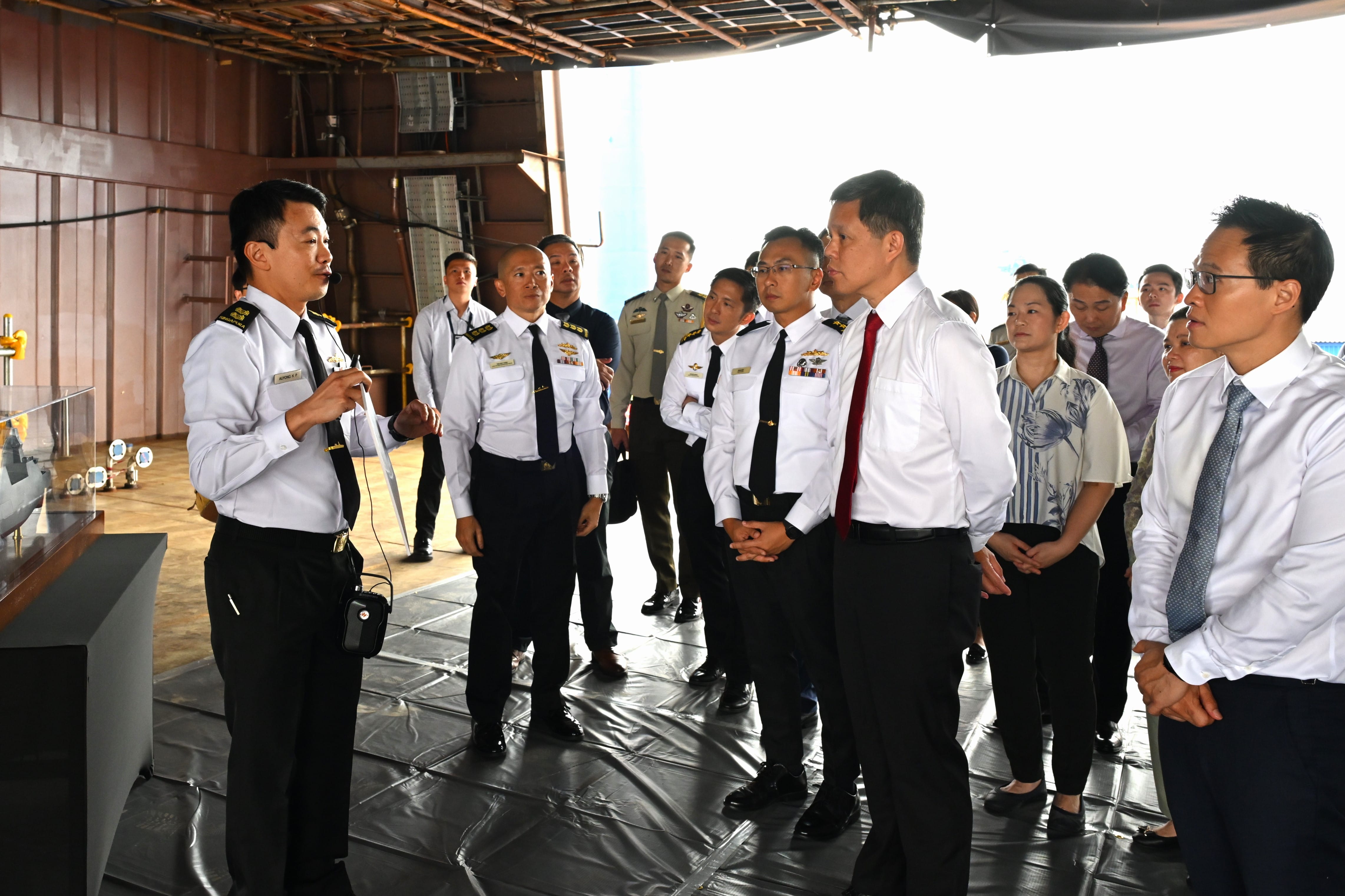 Mr Chan and Minister of State for Defence Mr Desmond Choo being briefed about the MRCV.